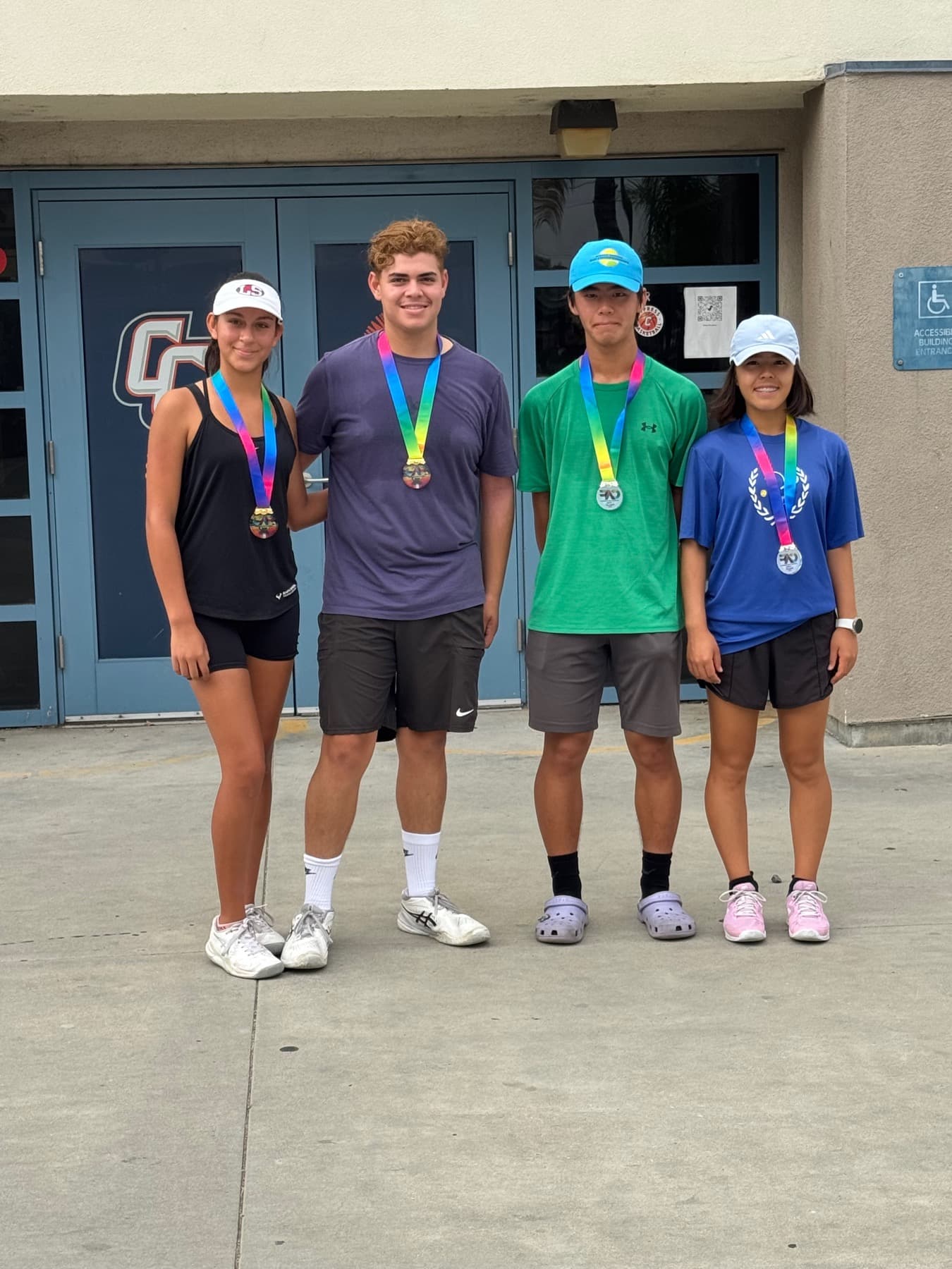 Tennis players wearing medals